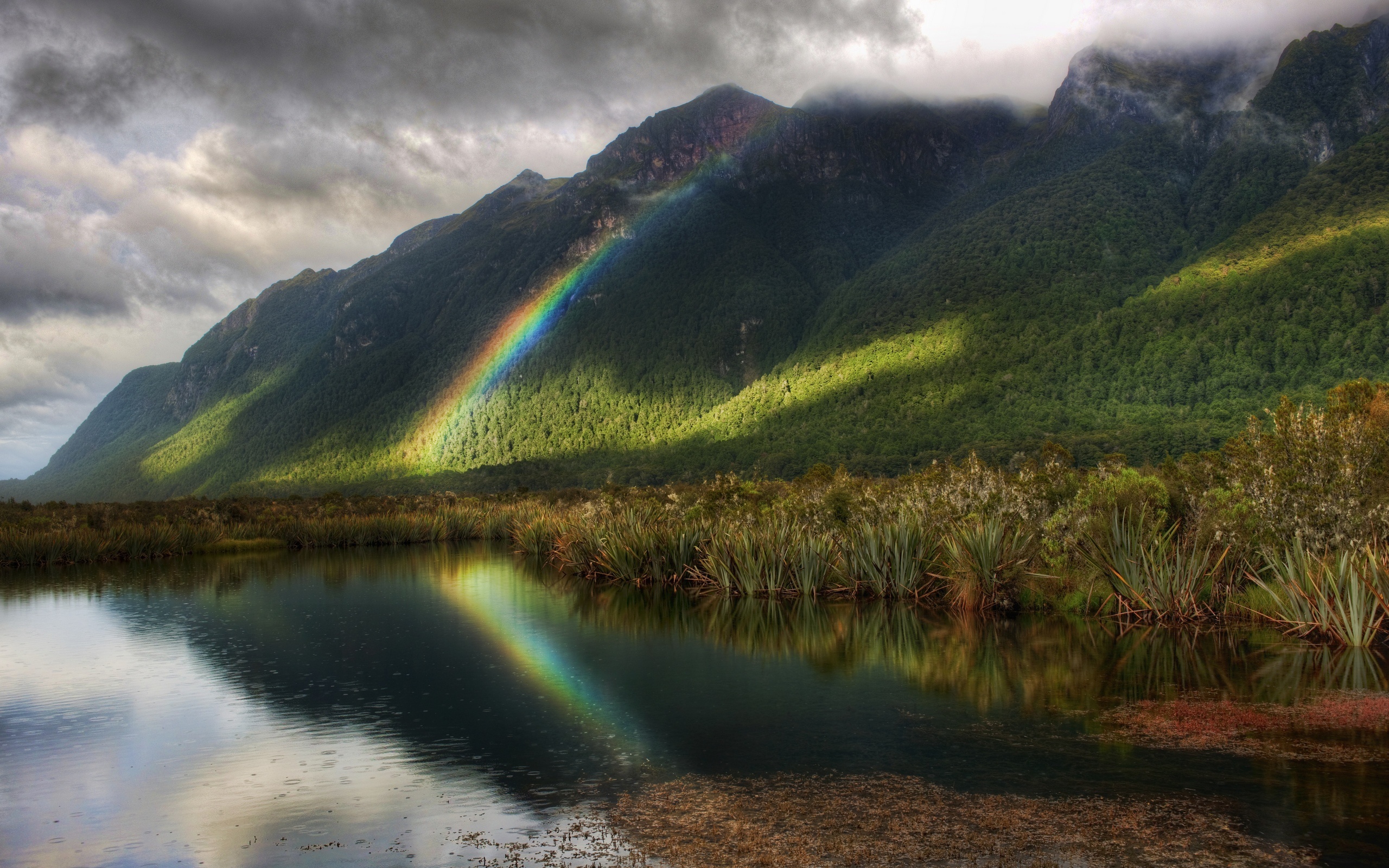 Rainbows reflect on the hills