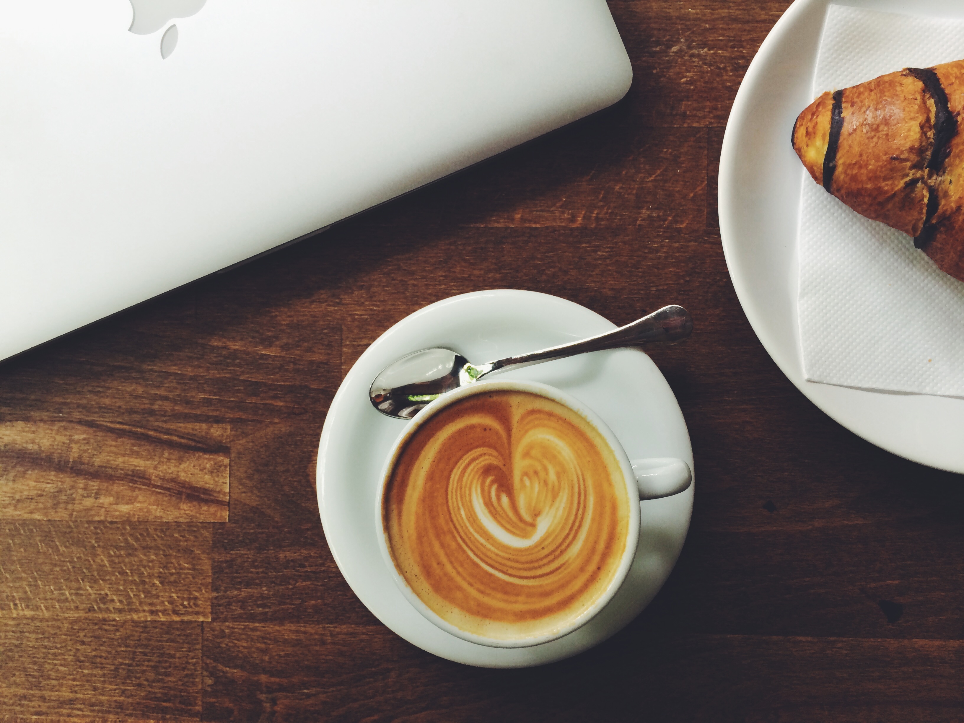 A morning cup of latte on a wooden table