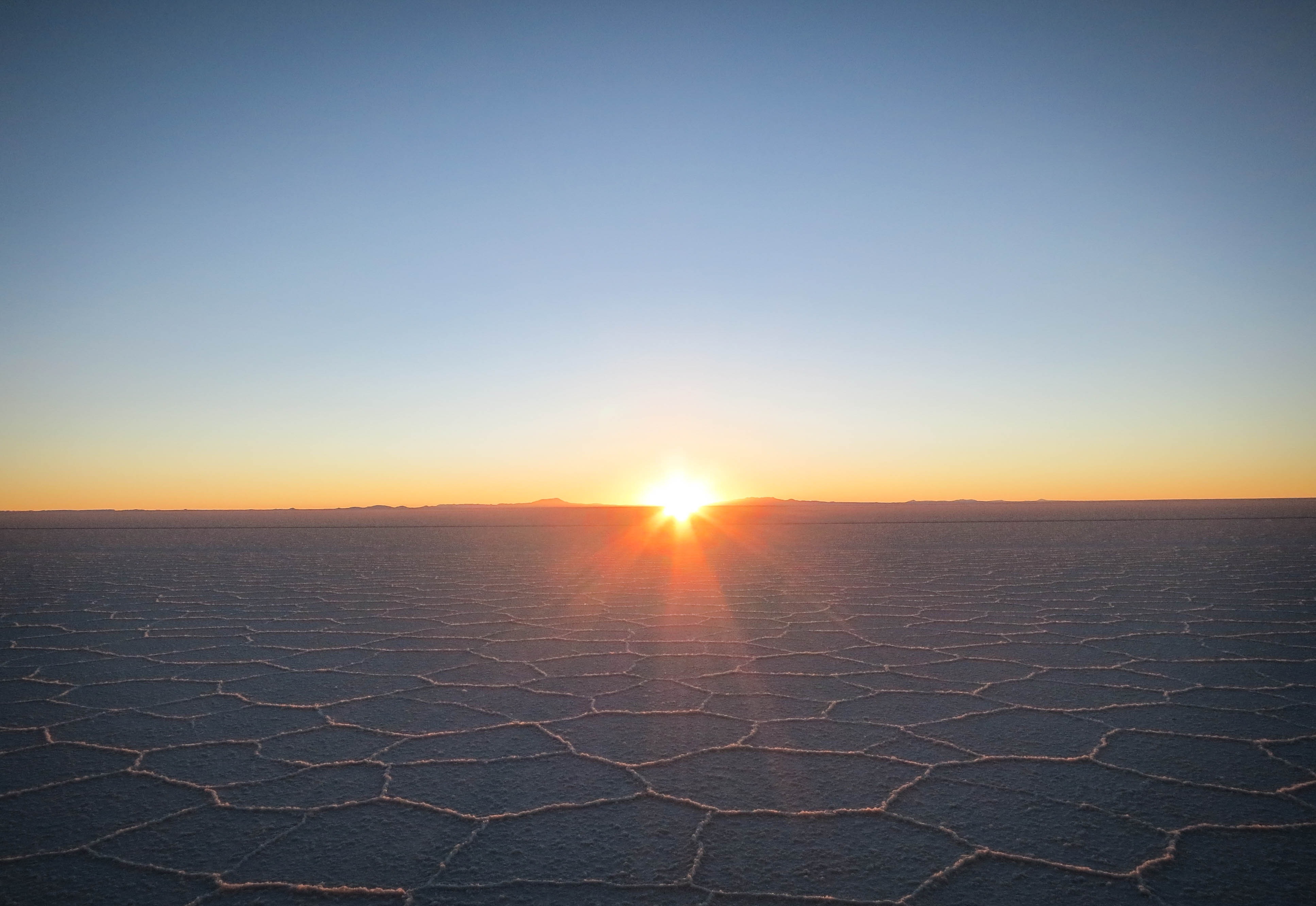 Free photo Sunrise on dried up land in the desert