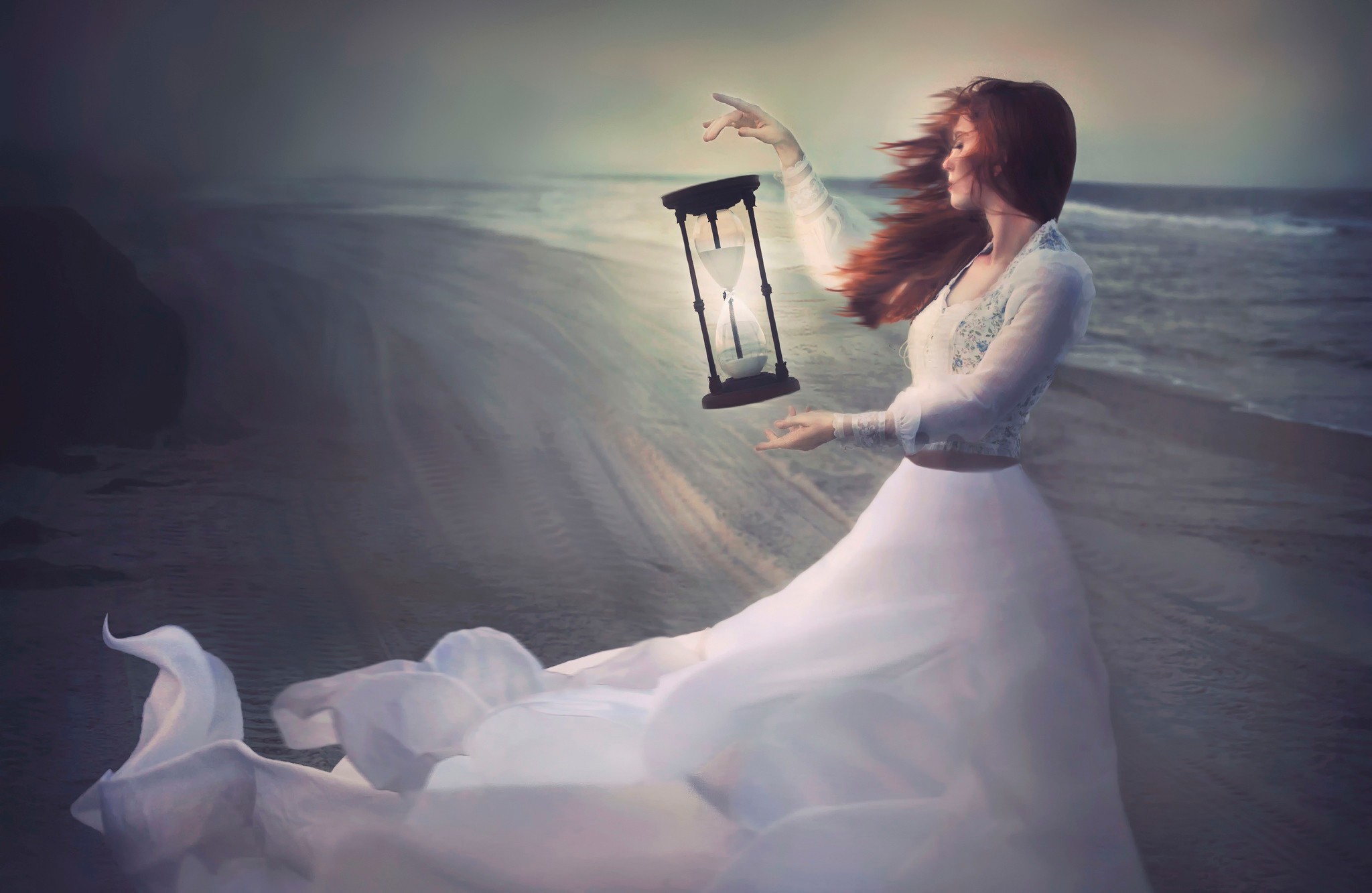 Free photo A girl in a white dress with sand flowers in her hands