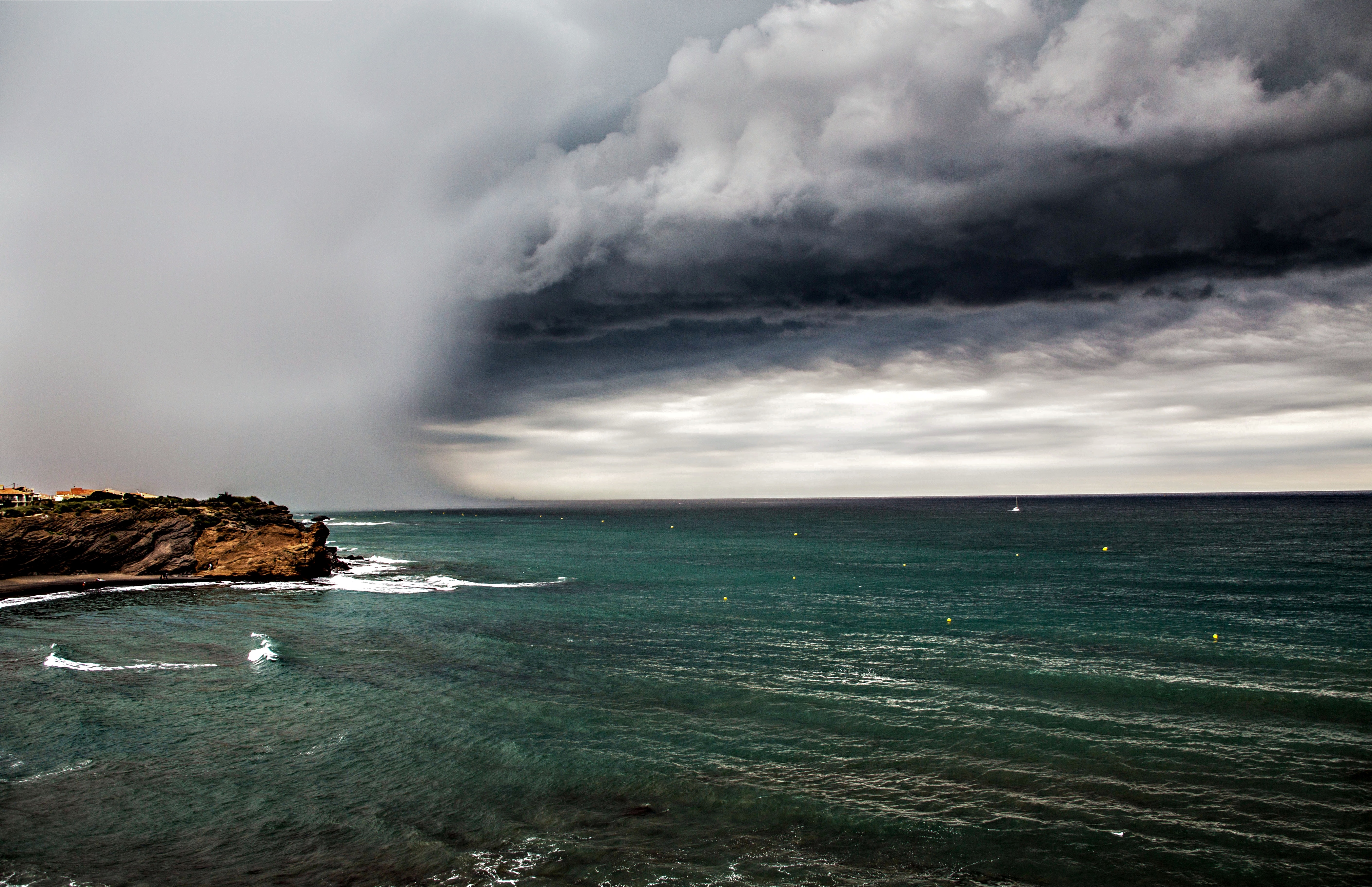 Free photo Clouds over the beach of the sea