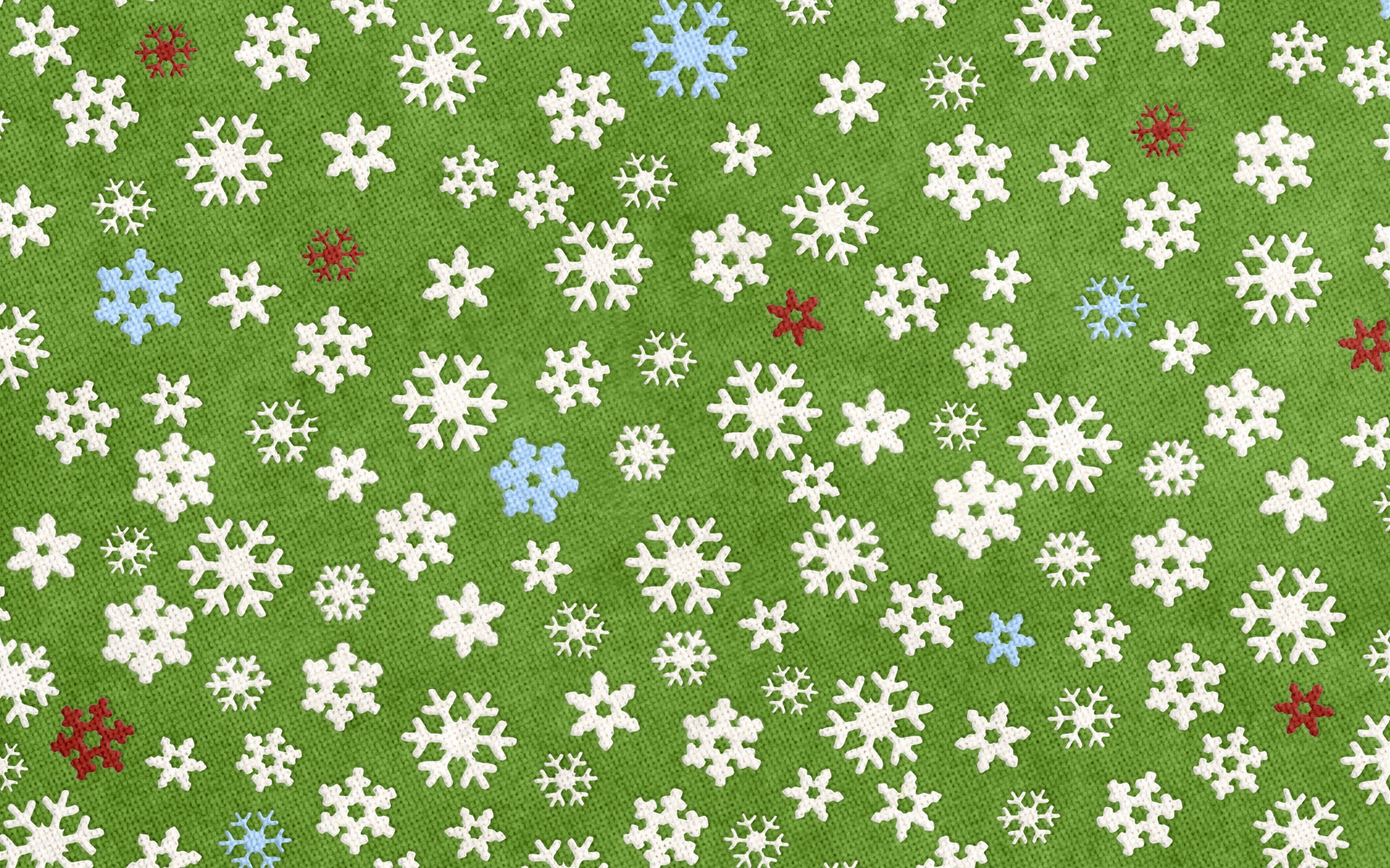 Green background with a pattern of white, blue, and red snowflakes.