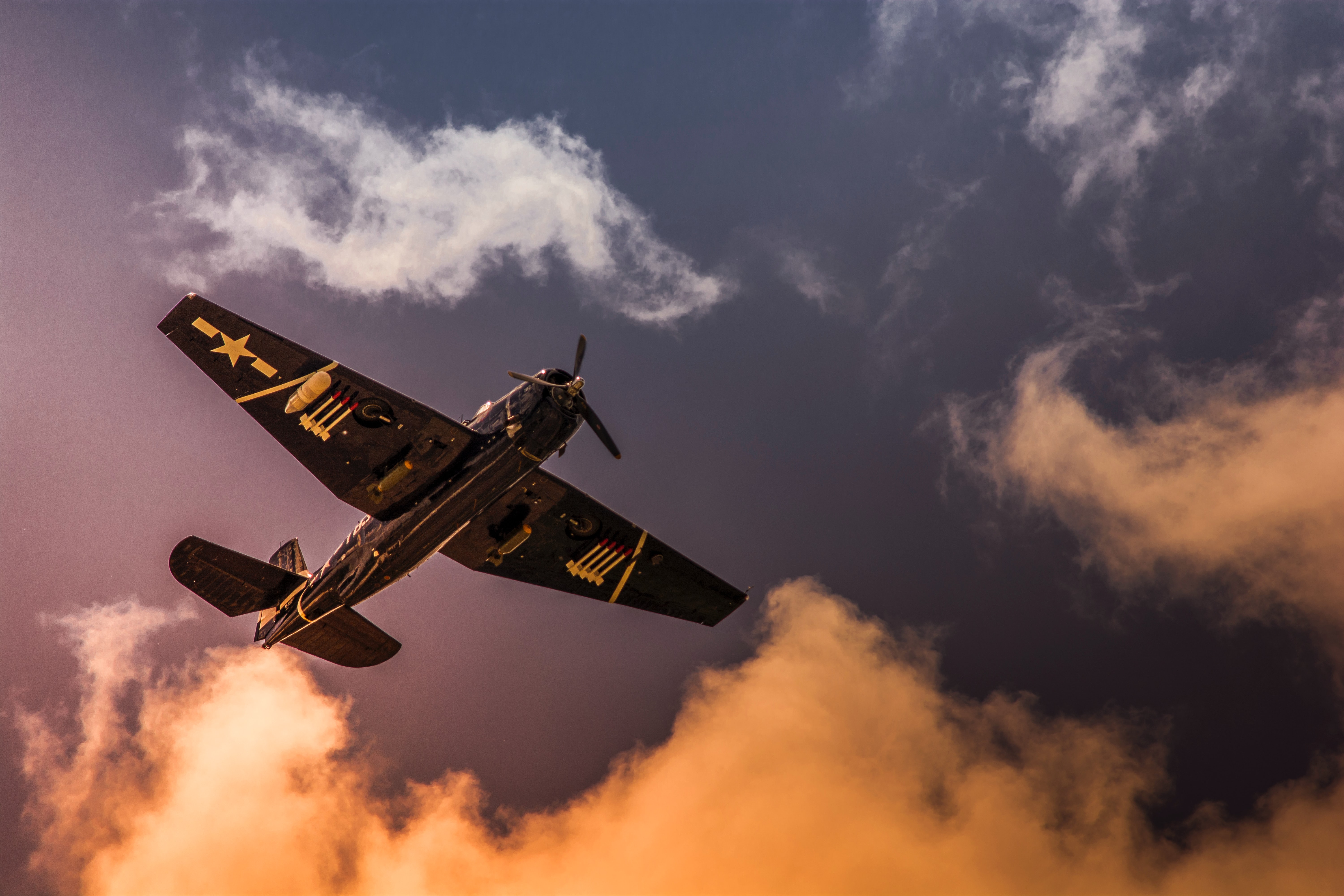 Free photo A black propeller airplane in the sky with bad weather