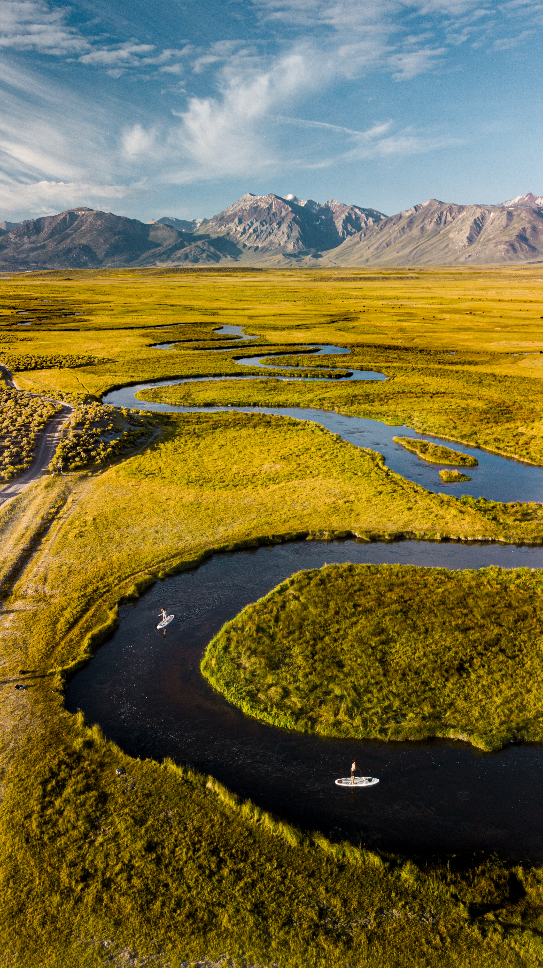 Free photo A meandering river in a field