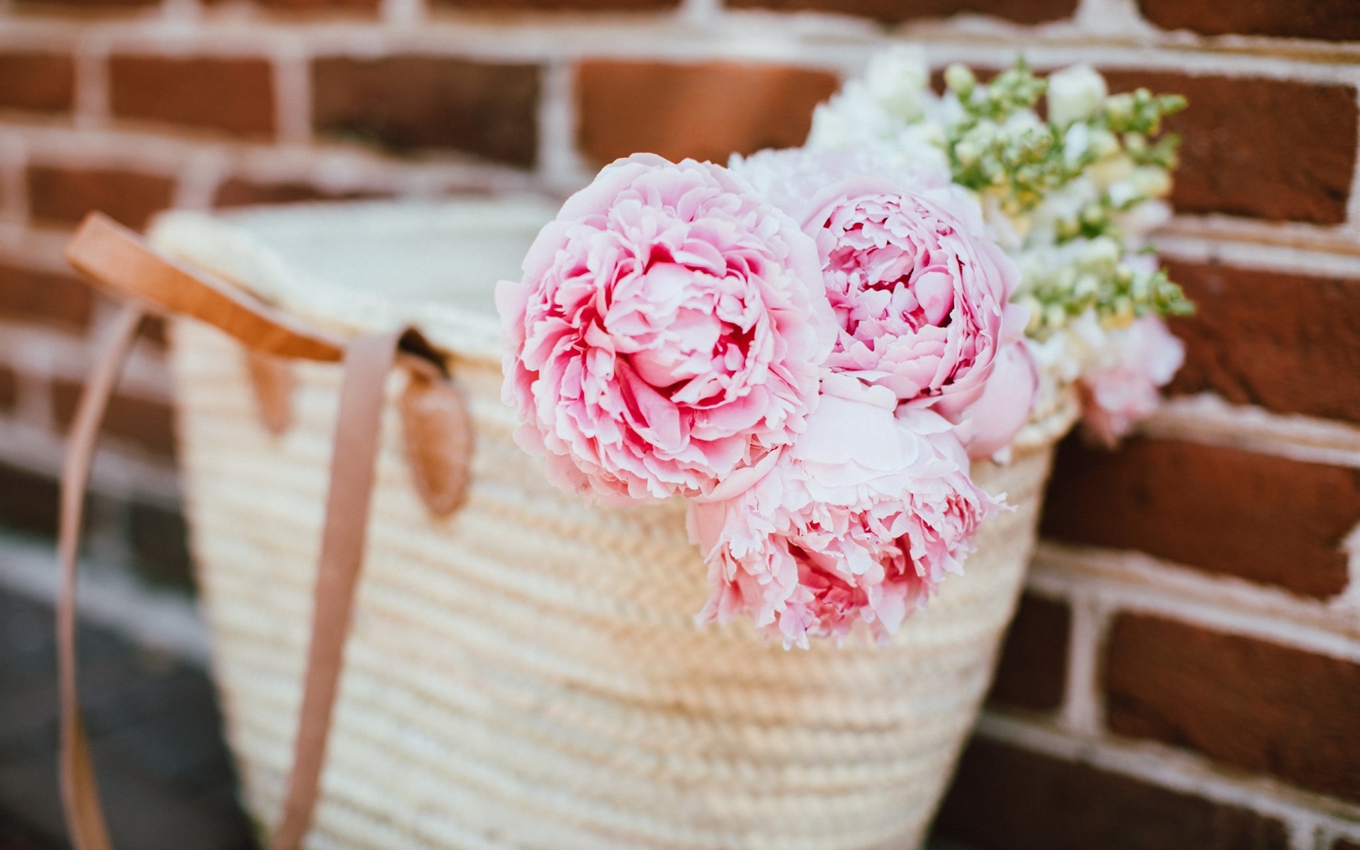 Pink peonies in a small basket