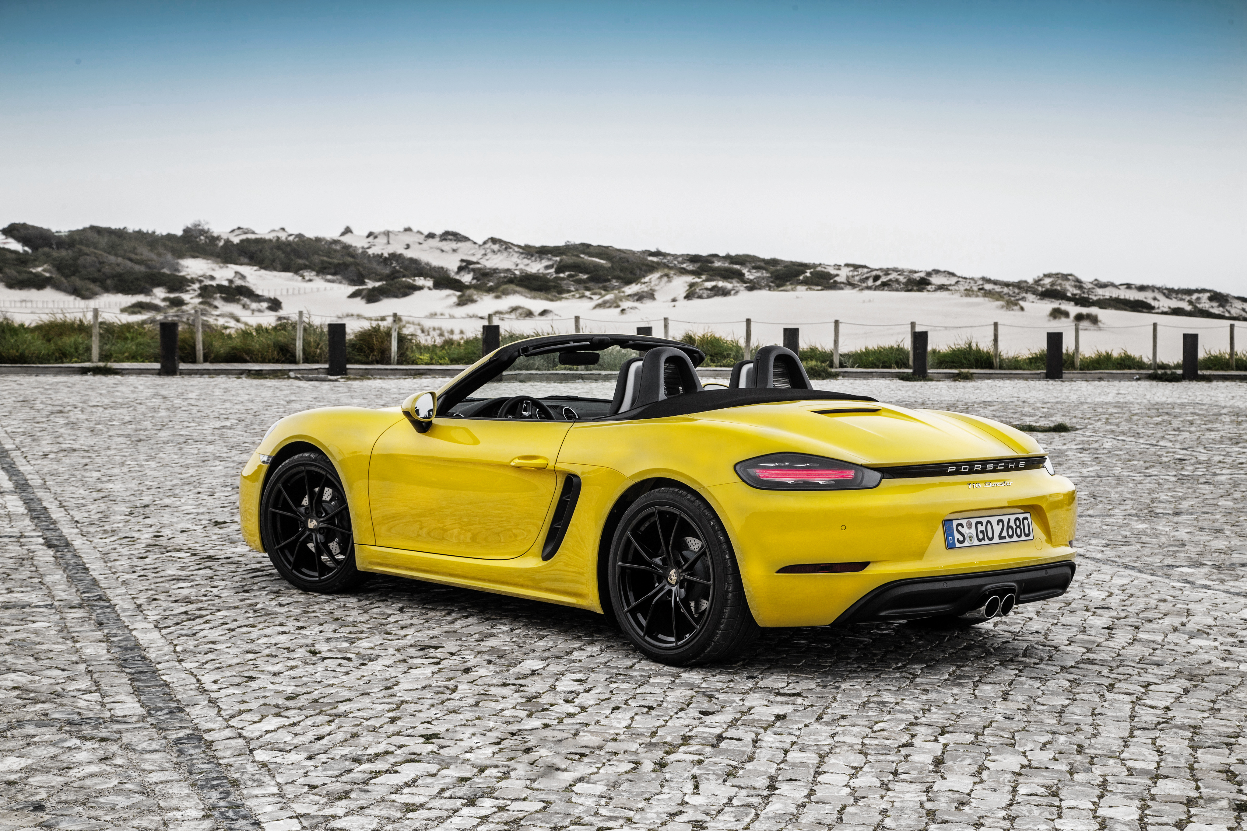 Free photo Yellow Porsche Boxster rear view