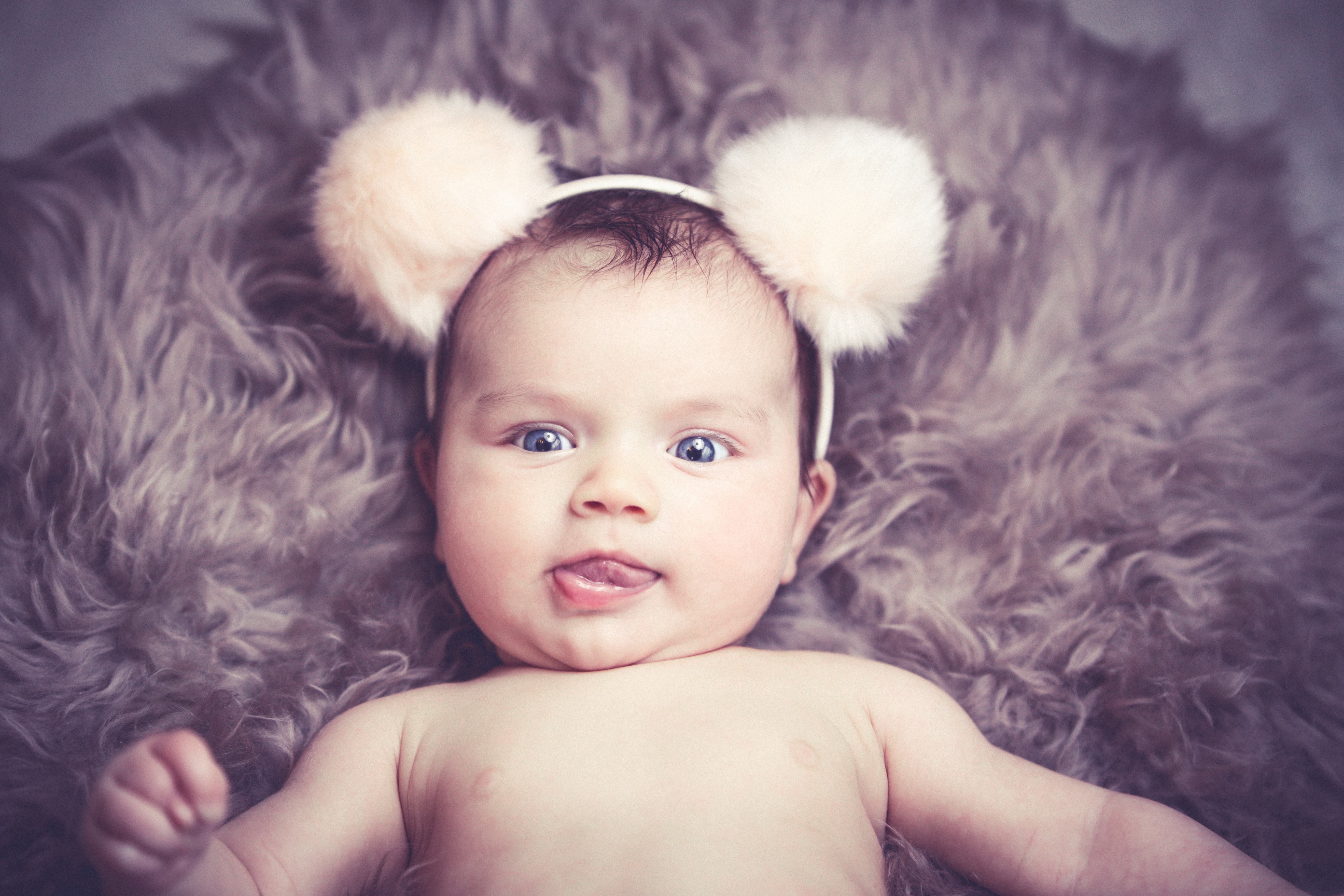 Free photo Pretty little girl with a hair hoop with ears